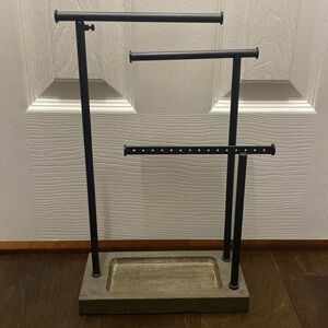 Jewelry holder including bracelets, necklaces, earrings, and rings.